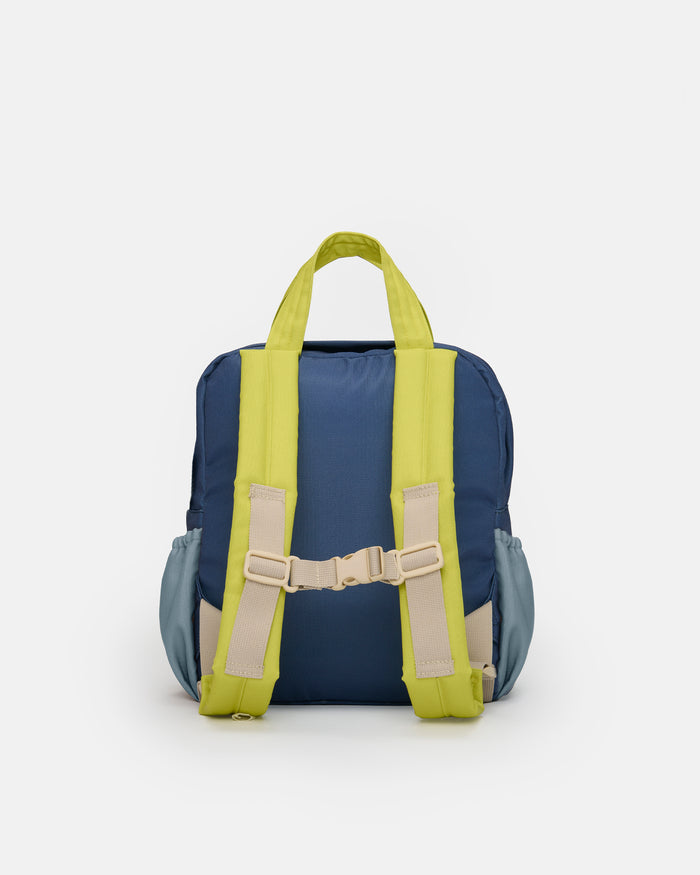 Small blue and gray backpack with green straps on a white background