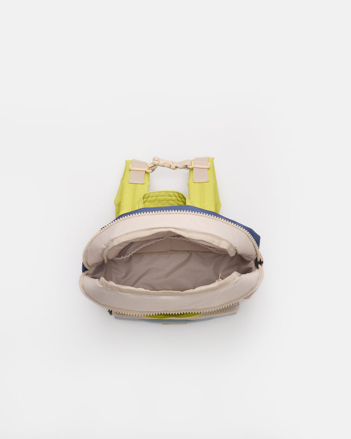 Open green and beige bag on a white background