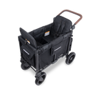 A black Wonderbug fold-down utility wagon stroller with a brown handlebar, shown from a three-quarters angle on a white background.