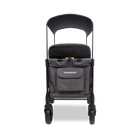 Black stroller with a bag on a white background