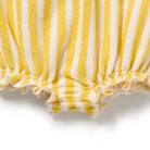 Close-up of yellow and white striped fabric with a textured pattern on a white background