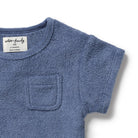 Blue baby outfit with a pocket on a white background