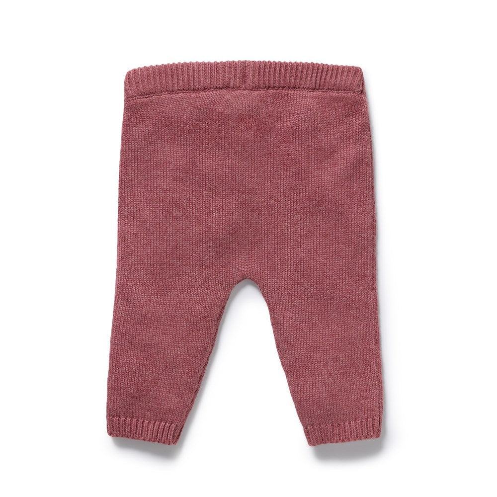 A pair of infant knit pants in a dusty rose pink color, featuring a ribbed waistband.