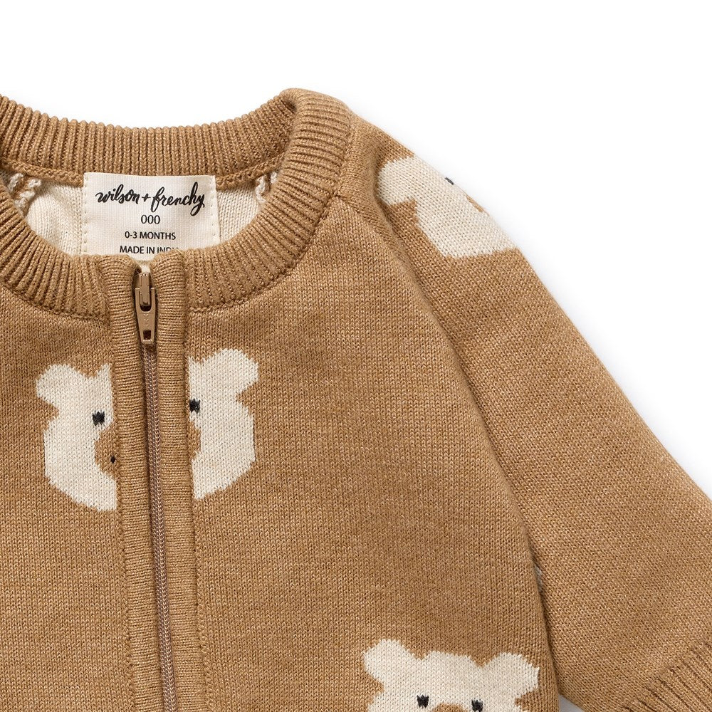 Brown baby sweater with bear designs and a visible brand label on a white background
