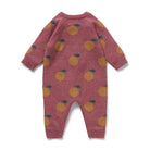 Pink baby romper with orange pattern on a white background