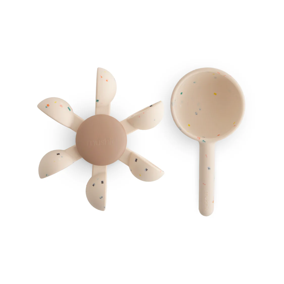 Beige baby bath toy set on a white background