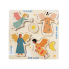 Wooden puzzle with four angel figures and celestial elements on a beige background