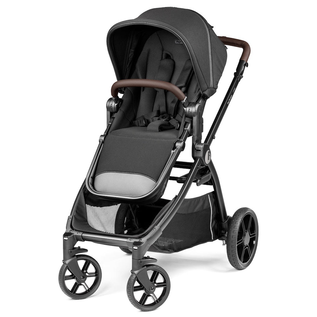 Black stroller with brown handle on a white background