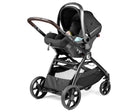 Black stroller with baby seat on a white background
