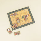 Board game with caterpillar and butterfly cards on a beige background