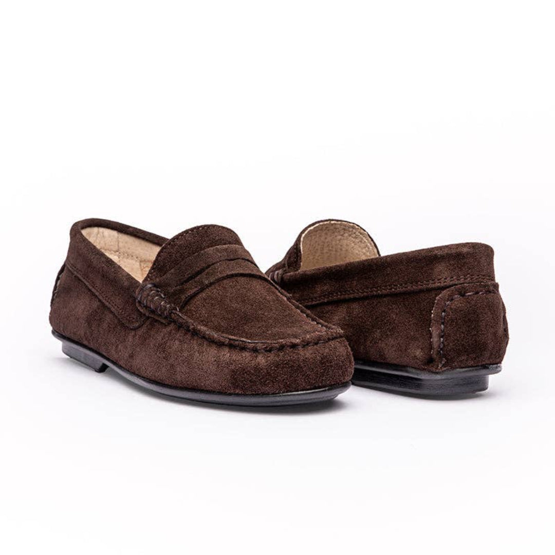 Pair of brown suede loafers on a white background