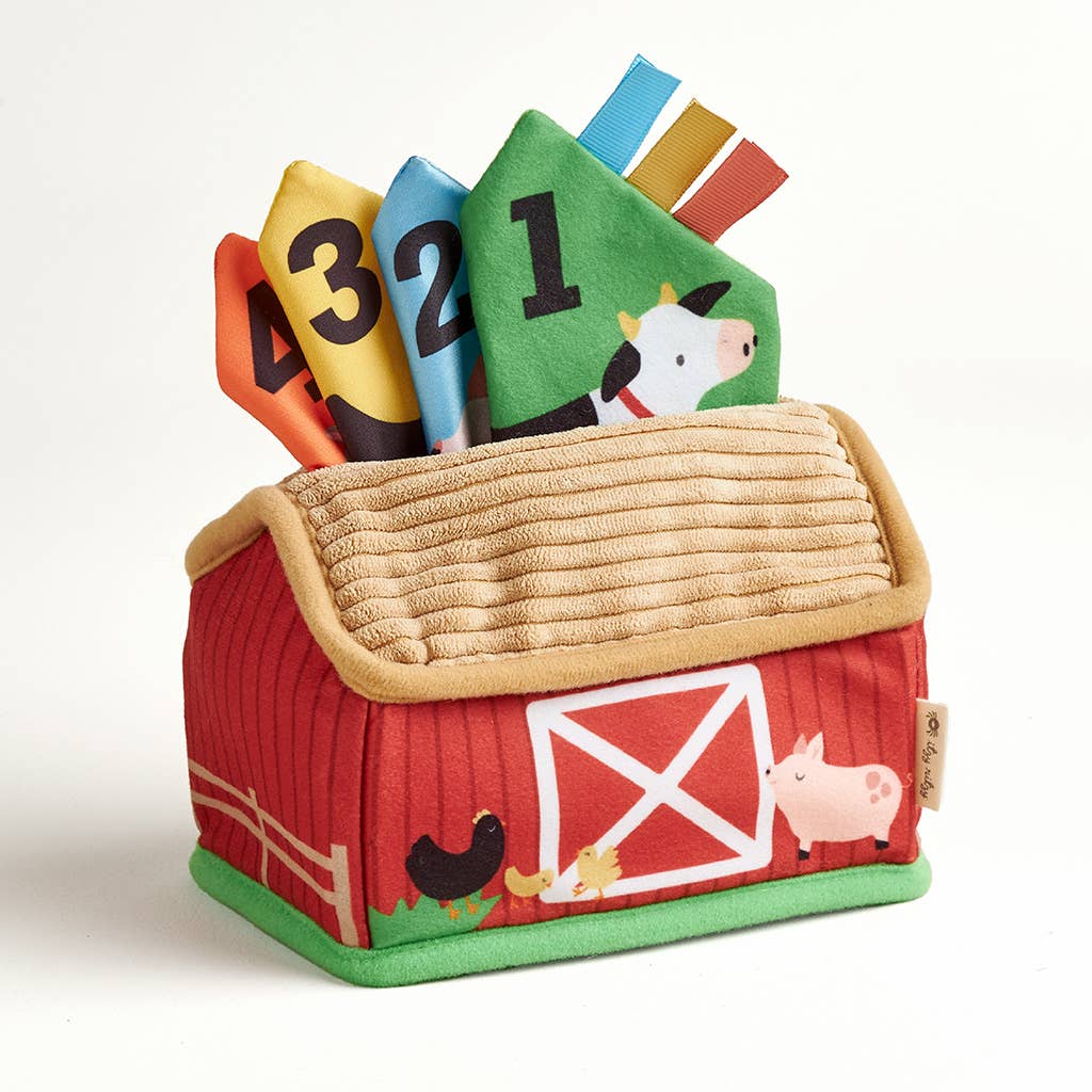 Toy barn with number cards and farm animal illustrations on a white background