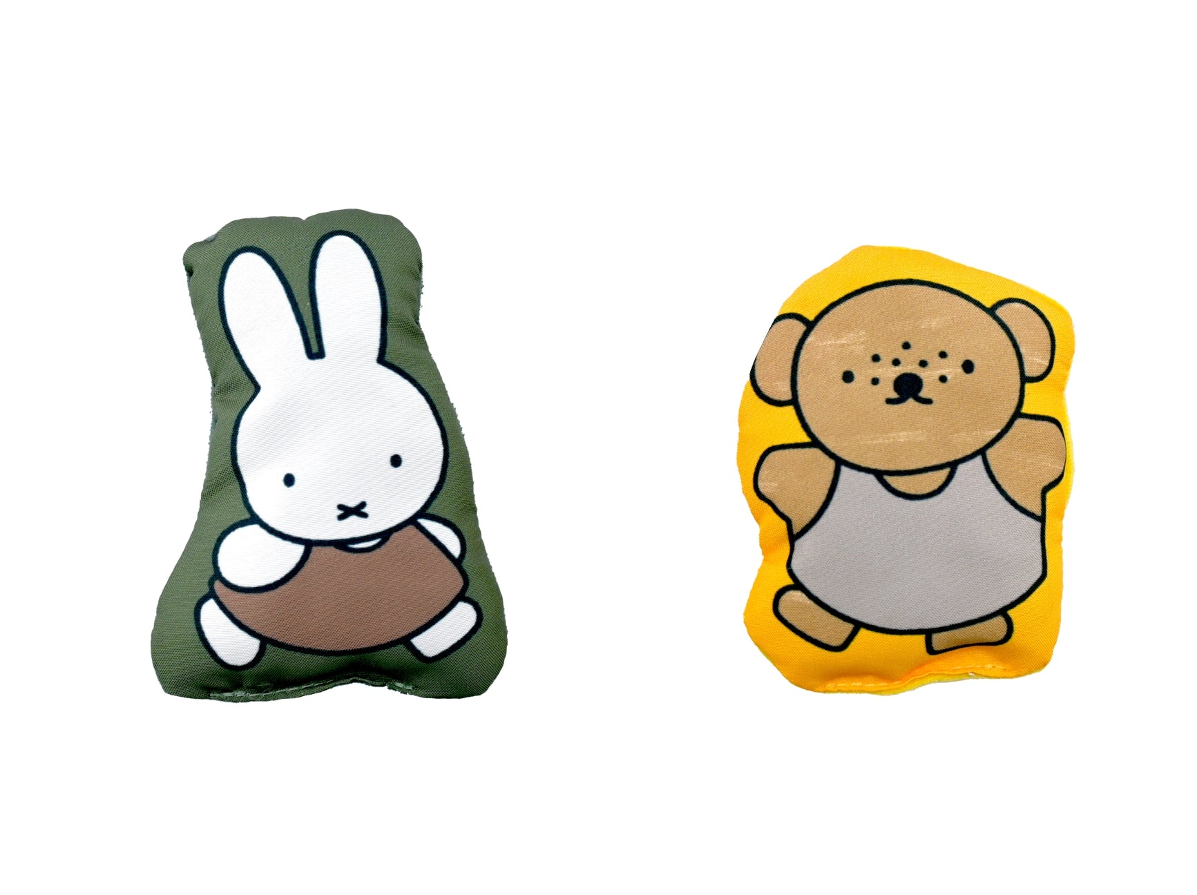 Two cartoon character cushions, one green with a rabbit design and one yellow with a bear design, on a white background.