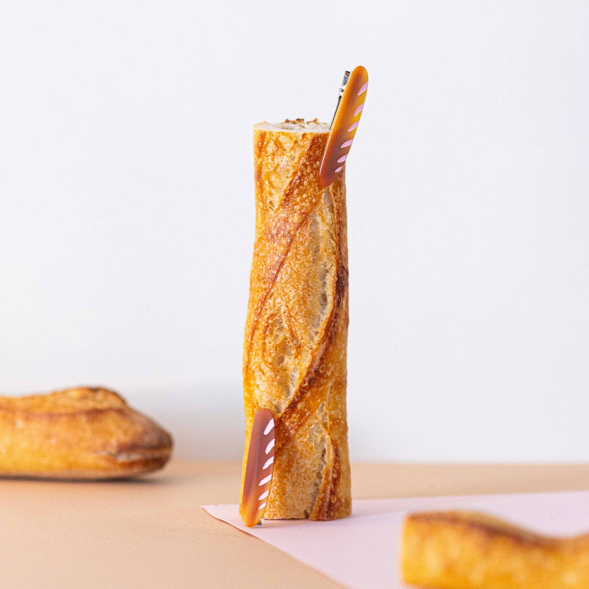 Rolled crepe with a straw on a white background
