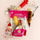 Ice cream play set with packaging on a pink background