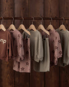 Rylee + Cru children's apparel collection featuring the Oversized Sweatshirt Daisy and coordinating floral pieces in earthy, muted tones.