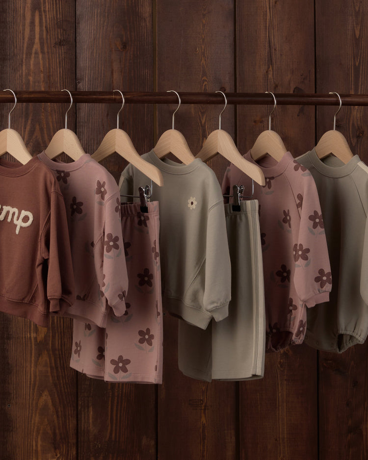 Rylee + Cru children's apparel collection featuring the Oversized Sweatshirt Daisy and coordinating floral pieces in earthy, muted tones.