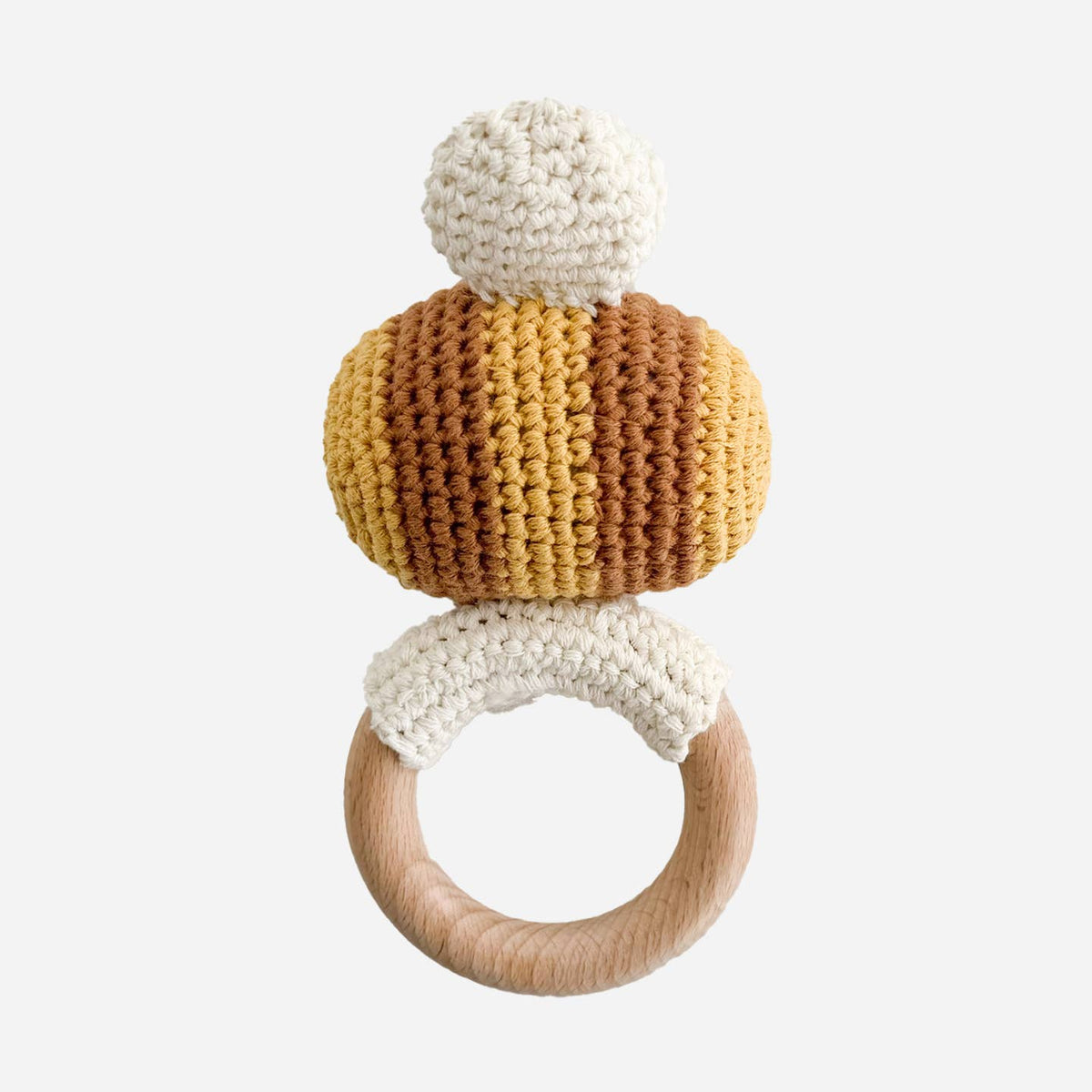 Crocheted teething ring with wooden ring on a white background