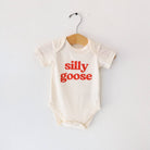 Baby onesie with 'silly goose' text on a white background