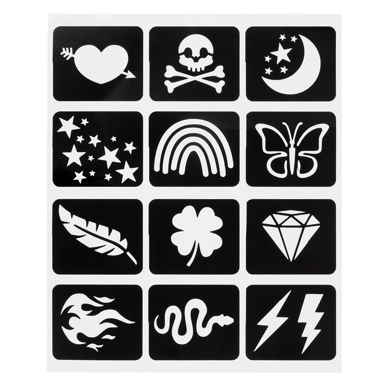 A sheet of twelve Tattoo Flair stick-on stencils against a white background, featuring a grid of white cut-out designs on black rectangular backing squares, including a heart pierced by an arrow, a skull and crossbones, a crescent moon with stars, a cluster of stars, a rainbow, a butterfly, a feather, a four-leaf clover, a diamond, a swirling tribal pattern, a snake, and lightning bolts.