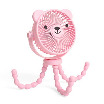 Pink fan with a bear face design on a white background