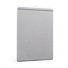 Gray spiral-bound notebook on a white background