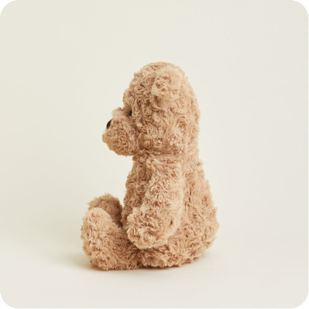 Plush toy dog on a beige background