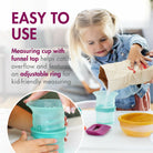 Child using a measuring cup with funnel top and adjustable ring, with text highlighting its features.