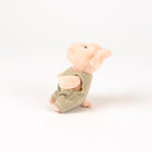 plush pink pig with beige romper - view from the side