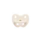 White baby pacifier with star and moon designs on a white background
