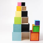 Colorful cube-shaped boxes stacked on a white background