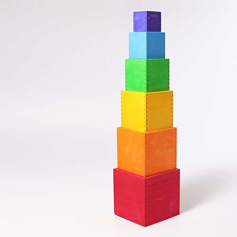 Stack of colorful building blocks on a white background