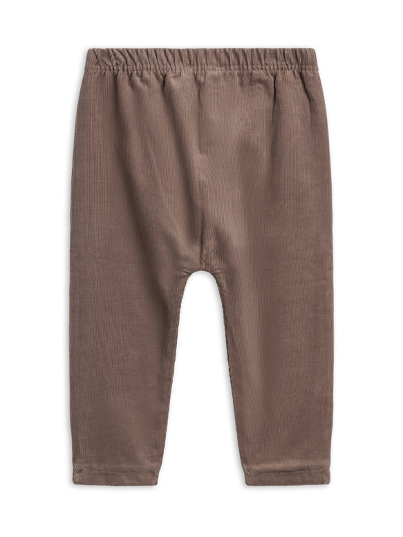 A pair of toddler's harem pants in a muted brownish-gray color, featuring an elastic waistband and relaxed legs, shown flat on a white background.