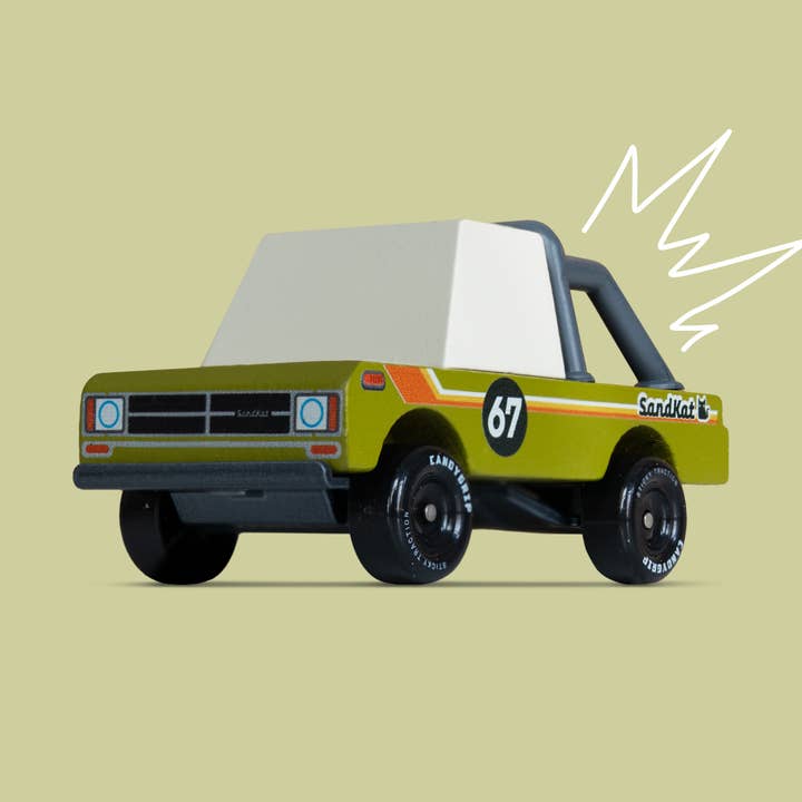 Toy truck with a white bed on a beige background