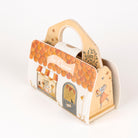 Cardboard house-shaped bag with cute illustrations on a white background
