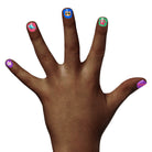 Hand with colorful nail art on a white background