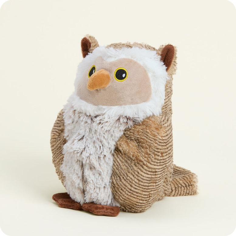 Woodland Owl by Warmies plush toy featuring brown and white textured fur, round yellow eyes, and an orange beak against a plain white background.