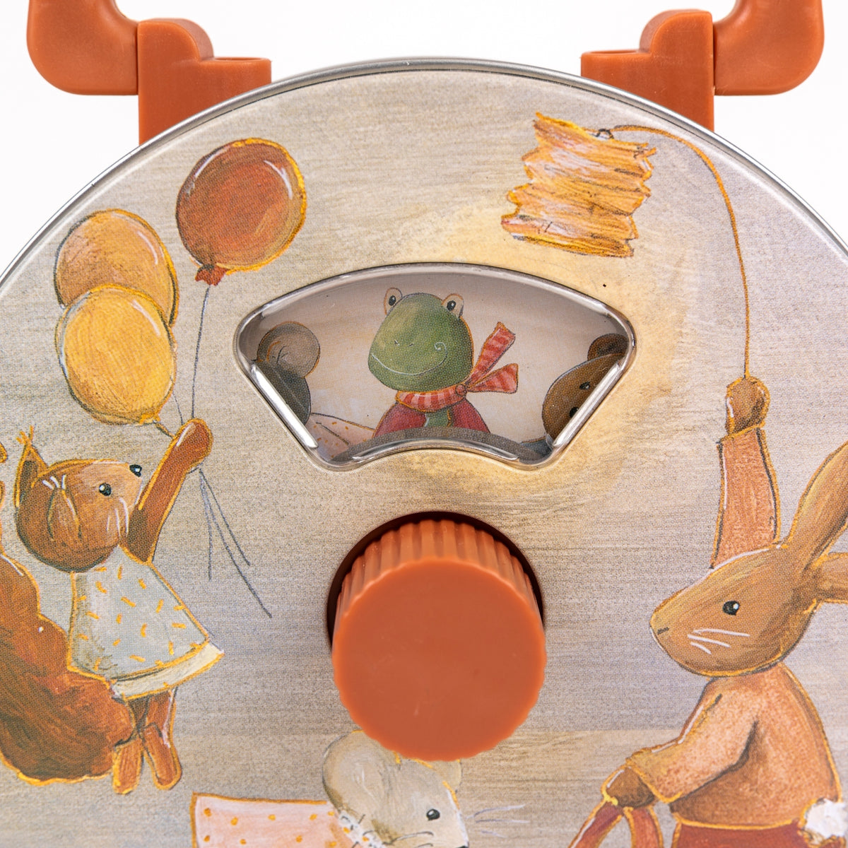Toy with cartoon characters and a central frog figure on a white background