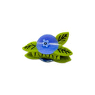 Green leaf-shaped clip with a blue center on a white background
