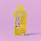 Yellow packaging with stickers on a pink background