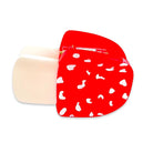A mushroom-shaped hair claw clip featuring a bright red cap with white spots and a beige plastic claw base, shown on a plain white background.
