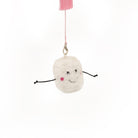 White plush toy with a smiling face and pink accents on a white background
