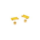Two yellow guitar bridge components on a white background