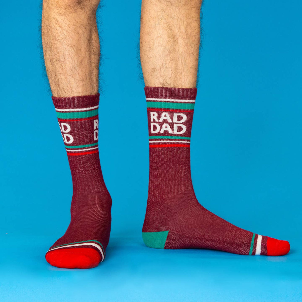 Maroon socks with 'RAD DAD' text on a blue background