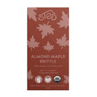 A single boxed chocolate brittle bar on a plain white background. The package is reddish brown with pale pink leaf illustrations and white text reading 'sted' and 'Almond Maple Brittle 70% Dark Chocolate.