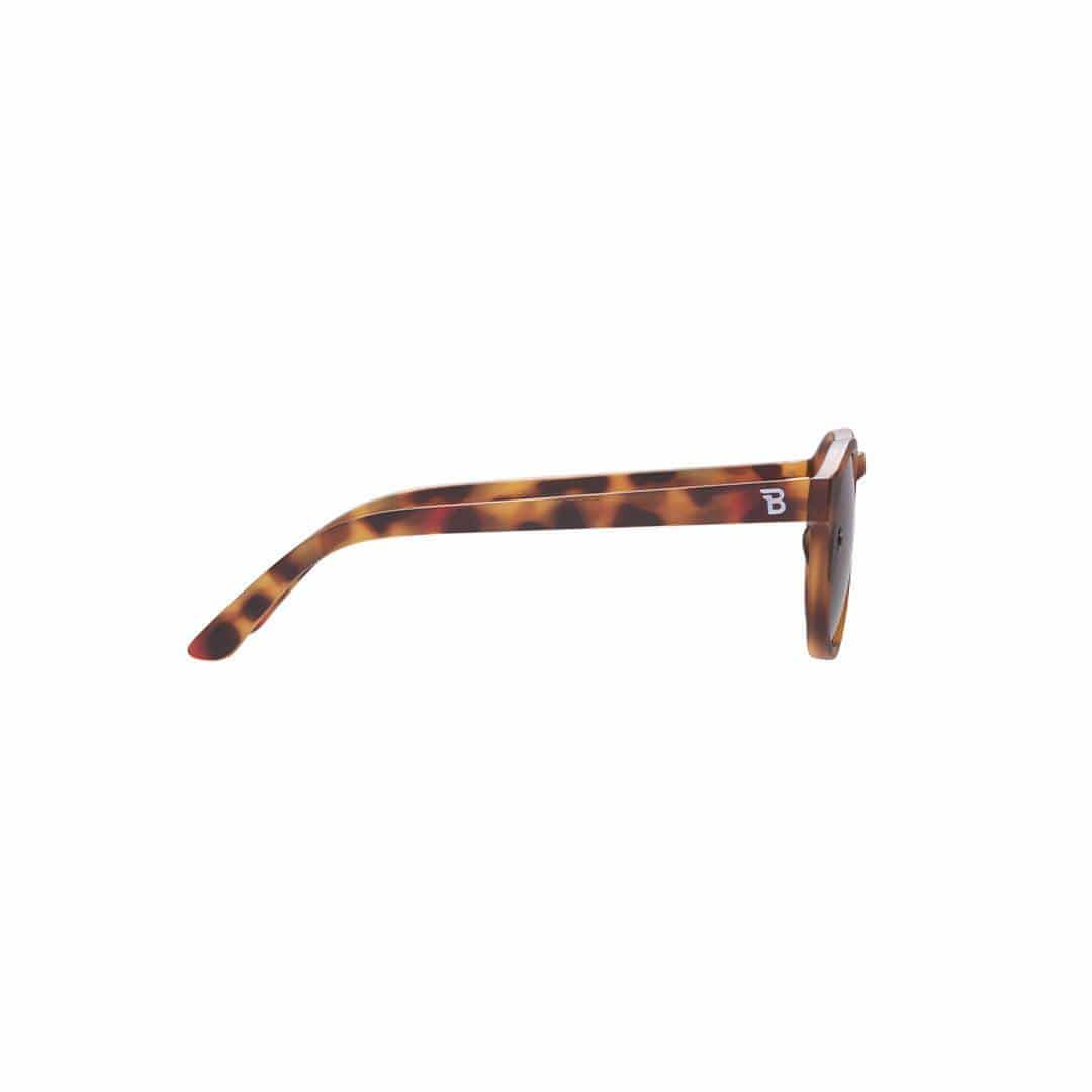 Tortoiseshell sunglasses with a brand logo on a white background