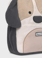 Dog-shaped backpack with a visible brand label on a light gray background