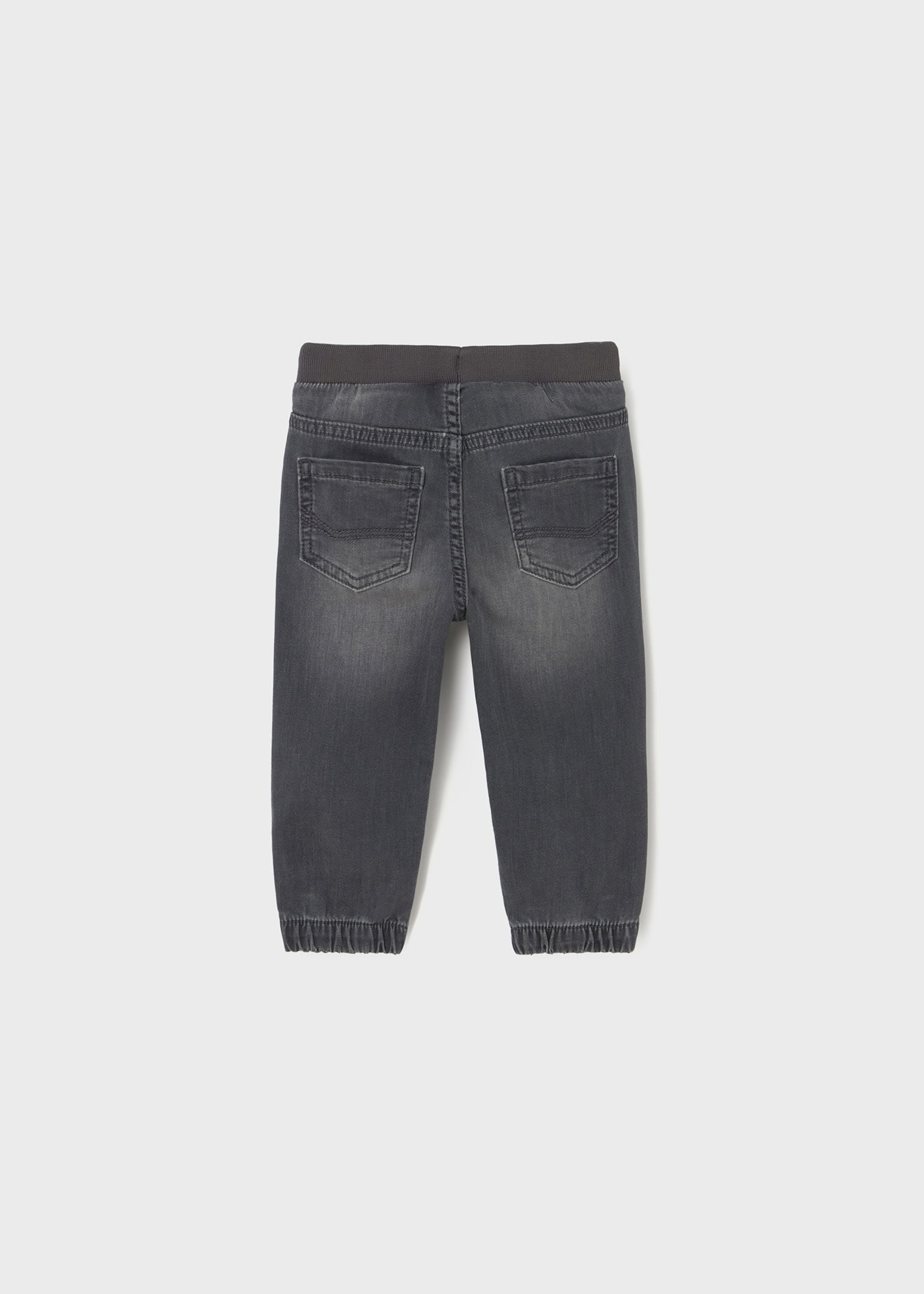 Back view of a gray denim jogger on a white background