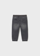 Back view of a gray denim jogger on a white background
