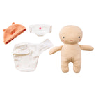 Baby clothing set with a hat, diaper, and two pairs of underwear, alongside a soft toy on a white background.